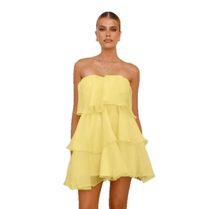 Sexy strapless yellow tiered ruffle mini dress for women featuring light chiffon layers