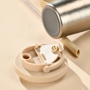 Detail of titanium water bottle base with non-slip pad and straw lid component