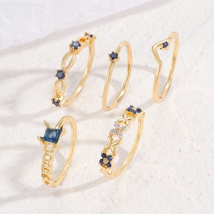 5-piece vintage gold-tone ring set featuring deep blue and white cubic zirconia stones