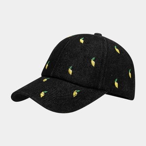 Classic black denim baseball cap with yellow and green lemon embroidery in 45-degree view