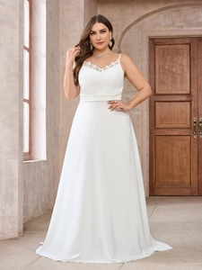 Elegant white lace V-neck plus size evening gown with a long trailing skirt for weddings