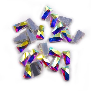 Macro shot of loose AB iridescent trapezoid crystal rhinestones on white background