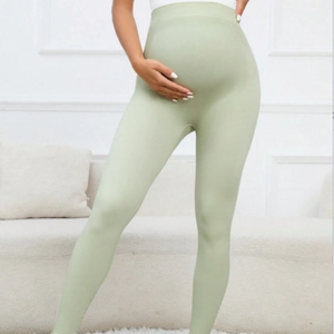Slim fit high waist light green maternity yoga leggings with supportive belly band