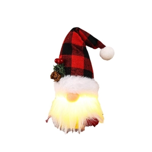 Light-up Christmas gnome with red plaid hat and warm LED glow on white background