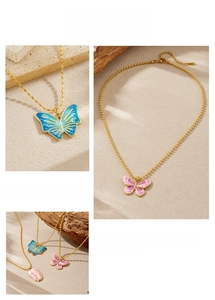 Close-up of blue and purple enamel butterfly and tulip pendants on gold beaded chains