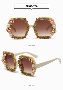 Detailed views of beige square sunglasses with brown rhinestones and floral accents