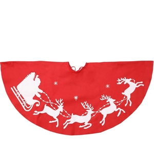 Detail of red Christmas tree skirt with white reindeer and sleigh silhouette patterns