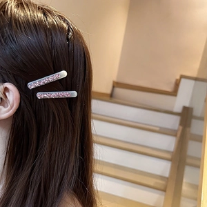 Elegant pink rhinestone rectangular hair clips for women shown on a model's hair