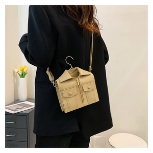 Detail of jacket-shaped beige PU leather crossbody bag with creative hanger handle
