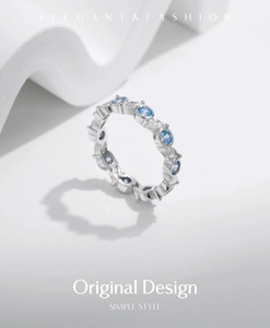 Macro view of s925 silver ring featuring blue and white zircon stones in prong setting