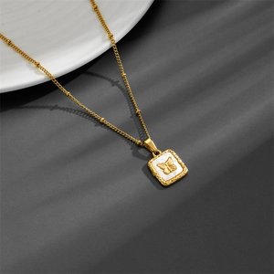 Golden titanium steel necklace featuring a square white shell pendant with a butterfly motif