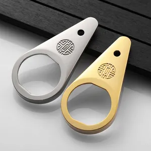 Set of premium metallic bottle openers in gold and silver with elegant droplet design
