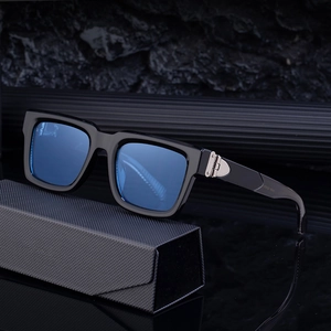 Square frame men's sunglasses with black frame and blue gradient lenses on carbon case