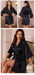 Detail of elegant black satin robe with wide three-quarter sleeves and waist tie design
