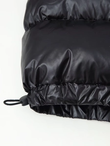 Detail view of glossy quilted hem with adjustable elastic drawcord and cord lock