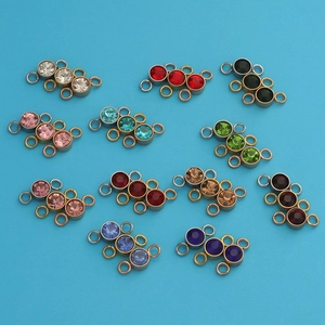 Detail view of multi-color birthstone connectors in gold and silver finish