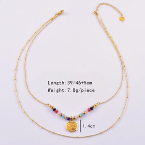 Detail of double-layer gold chain necklace featuring colorful beads and rose flower pendant