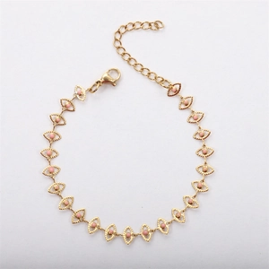 Detail of 18K gold plated stainless steel bracelet with pink evil eye enamel charms