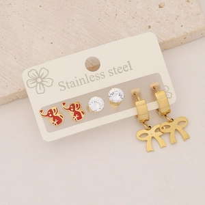 Detailed set of stainless steel earrings featuring red elephant and gold bow studs