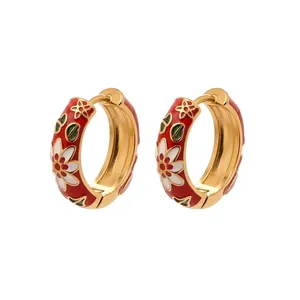 Detail view of 18k gold plated hoop earrings with enamel floral patterns and dimensions