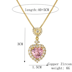 Detail shot of gold heart pendant with pink zircon and 40+5CM chain length specs