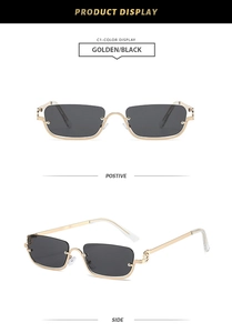 Detail view of golden metal half-frame square sunglasses with dark lenses and clear tips
