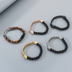Close-up of beaded bracelets with skull charms, tiger eye stones, and volcanic lava rock