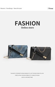Detail of blue denim and black crossbody bags featuring gold chain straps and hardware