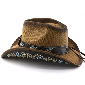 Detail of brown cowboy hat featuring gemstone flowers, embroidery and woven crown texture