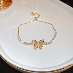Elegant gold adjustable butterfly bracelet with sparkling zircon stones in a French chic style
