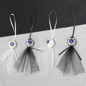 Creepy Halloween eyeball hanging decorations with bloodshot eyes and tulle skirts
