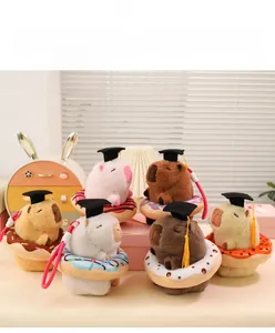 Detailed set of six capybara plush keychains with graduation caps and donut cushions