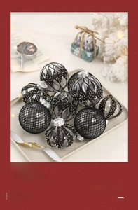Detail of Christmas balls with black and white patterns in a festive tray arrangement