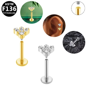 Detail showing ASTM F136 titanium labret studs with tiny flower crystal inlays