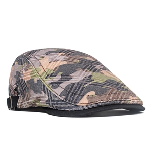 Close-up of camouflage flat cap with metal buckle adjustment and durable canvas texture