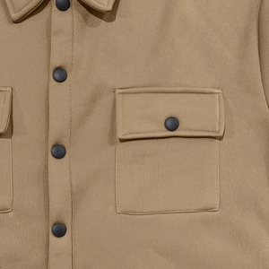 Detail of khaki heavy fleece jacket showing tactical chest pocket and snap button closure