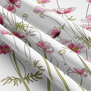 Detail of floral tapestry fabric with soft pink flower prints and fine woven texture