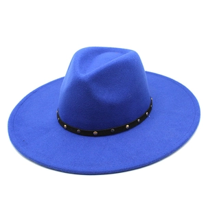 Detail of blue wool fedora hat featuring a black leather band with metal stud rivets
