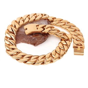 Chunky gold-plated stainless steel Cuban link necklace for men on a stone base