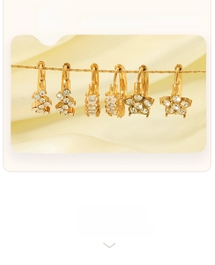 Detailed view of 18K gold plated earrings with zircon inlays and anti-tarnish coating