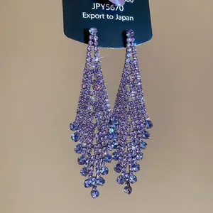 Elegant purple rhinestone tassel earrings with geometric diamond shapes in luxury style