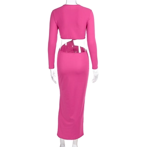 Rear view on mannequin of rose pink cutout dress with twist detail and open back