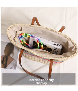 Top view of woven straw tote bag interior showing large capacity and striped lining