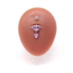 Silver stainless steel heart belly ring with pink crystal arrow design on a white background