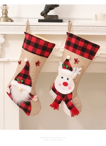 Close-up of 3D Christmas stocking featuring Santa and reindeer designs hanging on a fireplace