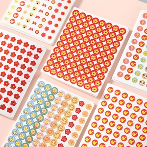 Set of colorful cartoon reward stickers featuring red stars and flowers for students