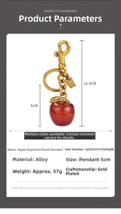 Macro detail of red glitter apple keychain with golden alloy clips and size dimensions