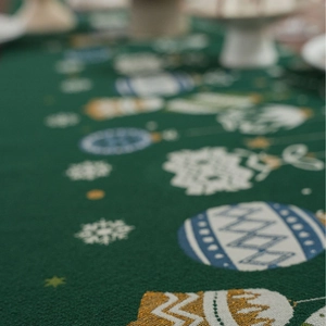 Christmas table runner with green candy jacquard, gold glitter ornaments and tassels