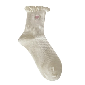 White crew socks with ruffled edges and pink heart embroidery in soft cotton knit
