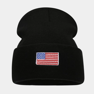 Classic black knitted beanie with American flag embroidery for winter outdoor warmth